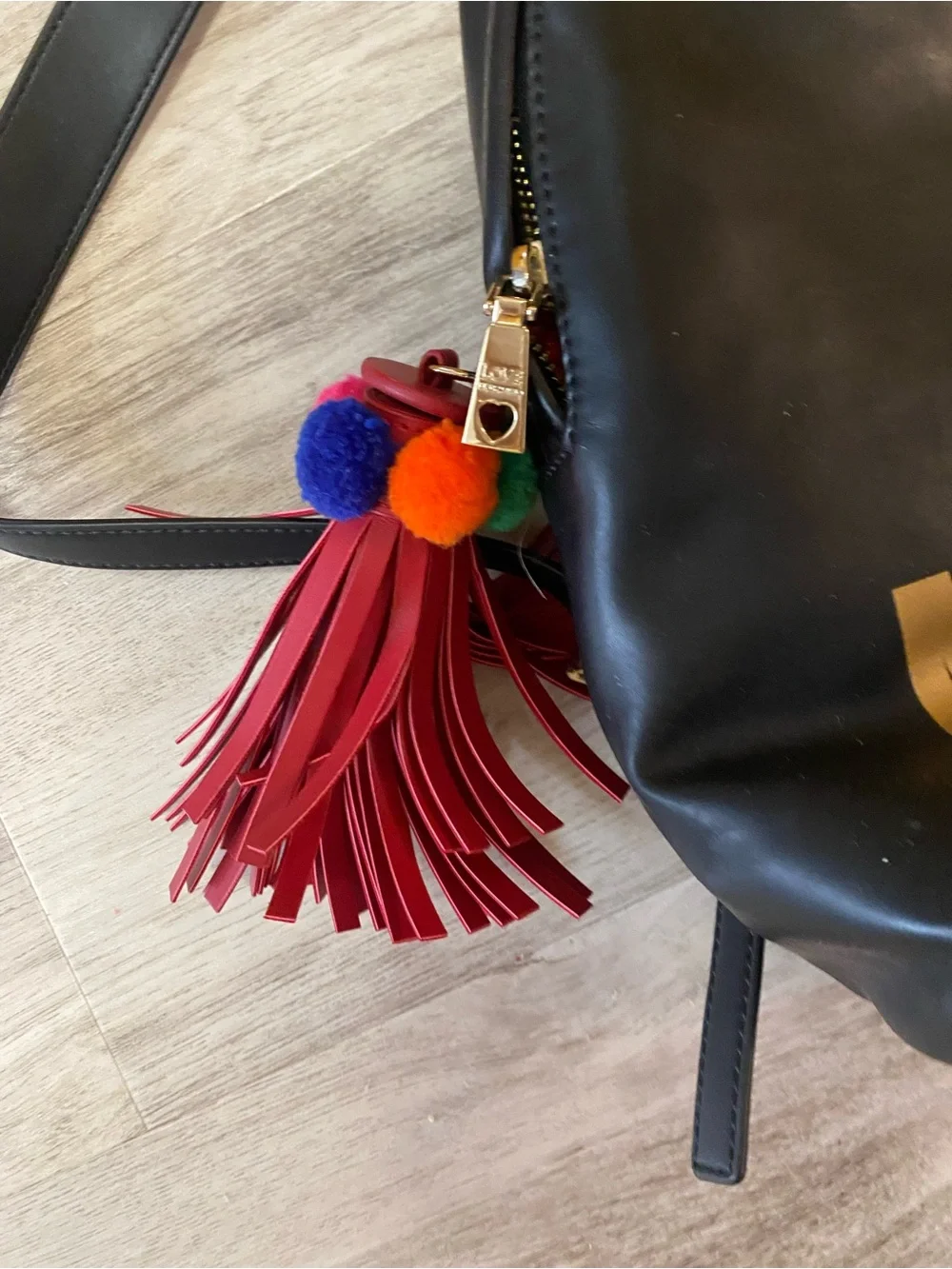 Love Moschino Black Backpack with Gold Logo and Red Tassel